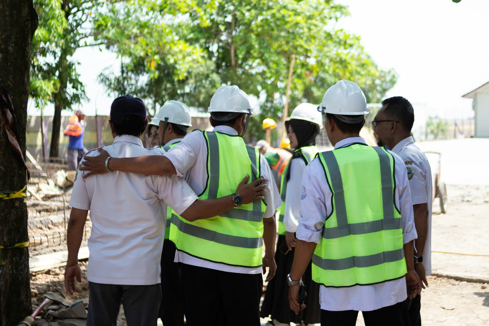 Site team in hi-vis and hard hats on a construction site